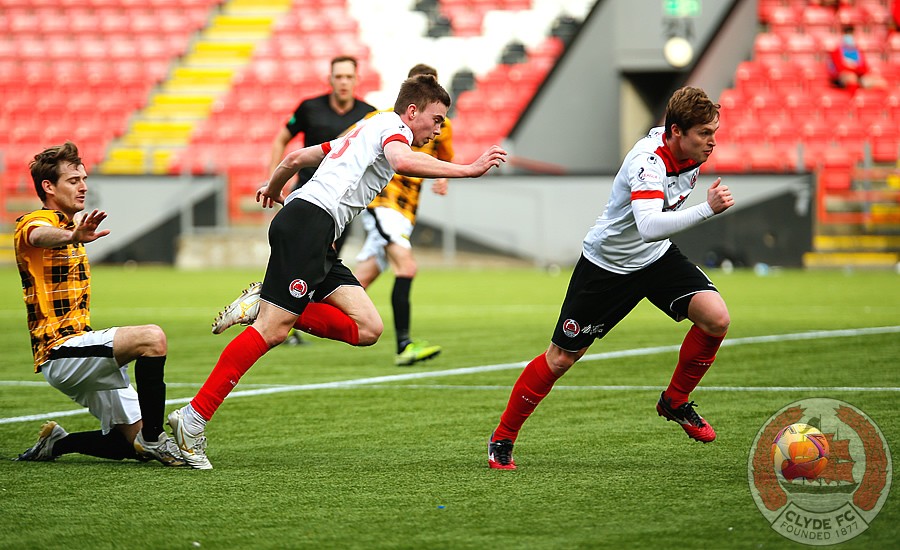 Barry Cuddihy tries to launch a Clyde attack from midfield.