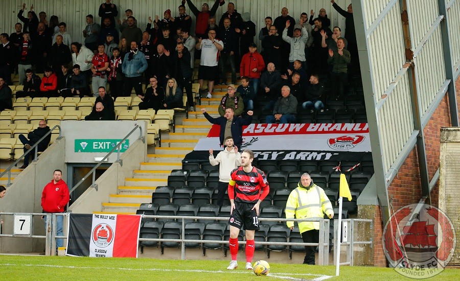 Ally Love takes a corner in front of the travelling support