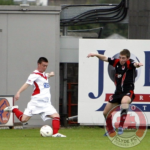 Alan Lowing moves to block a Joe Cardle cross.