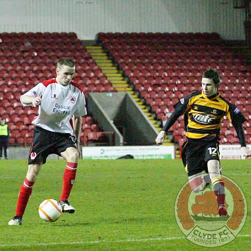 Adam Strachan looks to go forward with the ball.