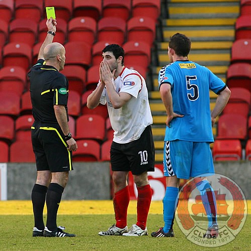 McCusker is shown a second yellow card.