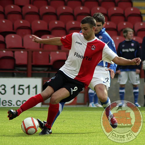 Stephen McDonald tries to turn with the ball.