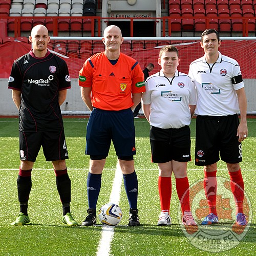 The match mascot with the captains before kick-off.